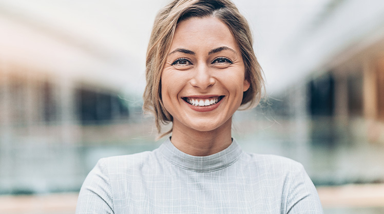 female employee smiling at camera